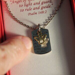 Angel necklace gold tone with silver tone dog tag with saying. New in box.
